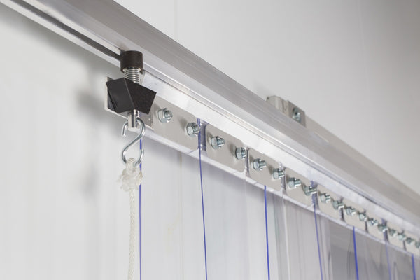 Sliding track hardware for a strip curtain door